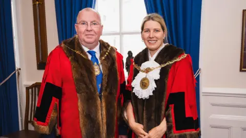 Douglas City Council Peter Washginton (left) and Natalie Byron-Teare (right) wearing their chains and robes of office.