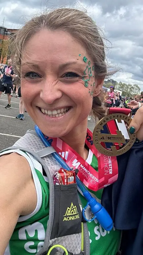 Vicky Hilton poses with her Manchester Marathon medal.