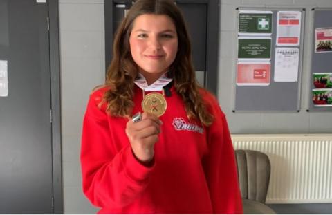 Grimsby cheerleader Tilly with her gold medal