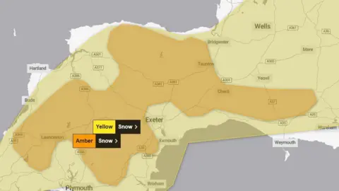 Met Office A map showing the South West of England. There is a large yellow shaded block covering most of the map, indicating a yellow warning for snow. A smaller irregular shaped orange block, covering areas of Somerset and Devon, indicates an amber warning for snow.