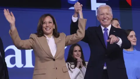 EPA Kamala Harris and Joe Biden stand together after the president gave a speech at the Democratic National Convention on Monday. 