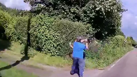 Paula Attwood-Rees attacks her neighbour near a road and a large hedge