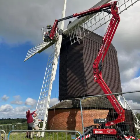 Brill Mill A crane is helping people work on Brill Windmill