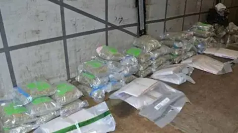 PSNI A number of plastic bags on the floor of a lorry filled with drugs