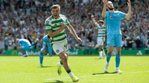 SNS Winger James Forrest celebrates scoring an injury-time equaliser for Celtic