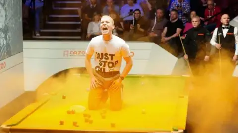 Eddie Whittingham of Just Stop Oil disrupts a snooker match at The Crucible in 2023