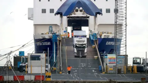 Reuters Lorries leave a ferry at the Port of Larne, Northern Ireland Britain January 1, 2021.