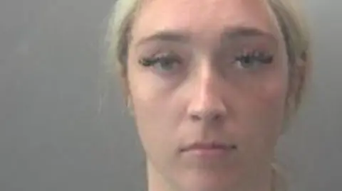 A custody photo of a blonde women