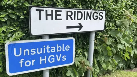 Small blue roadsign with the words "Unsuitable for HGV's"