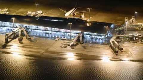 Reuters An aerial view shows a flooded runway at Kansai airport, Osaka on 4 September 2018