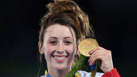 Jade Jones shows off her Olympic gold medal from 2016