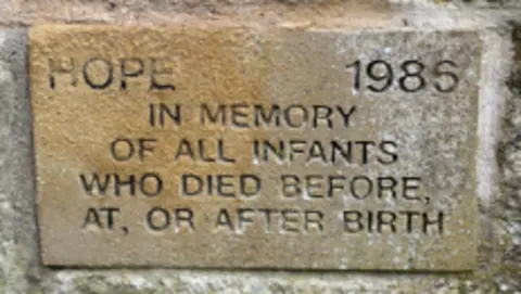 Barbara Gow A small plaque which says in memory of all infants who died before at or after birth 