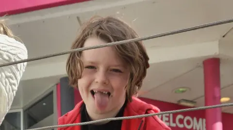 Wiltshire Police Lennix smiling at camera with his tongue out