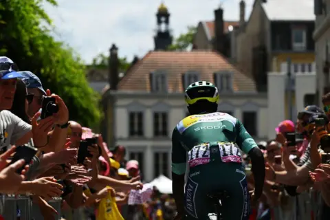 TIM DE WAELE/GETTY IMAGES Biniam Girmay of Eritrea and Team Intermarche - Wanty - Green Sprint Jersey prior to the 111th Tour de France 2024, Stage 9 a 199km stage from Troyes to Troyes / #UCIWT / on July 07, 2024 in Troyes, France. (Photo by Tim de Waele/