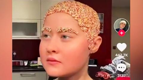 A TikTok content creator whose head is decorated with Hundreds and Thousands