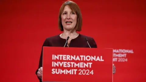 Getty Images Chancellor Rachel Reeves standing at a lectern giving speech at International Investment Summit on Monday