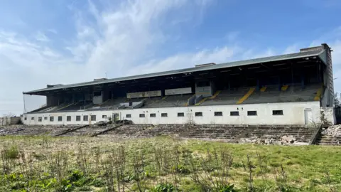 The grandstand at a derelict Casement Park.