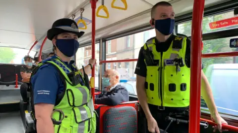 TFWM Police officers on a bus
