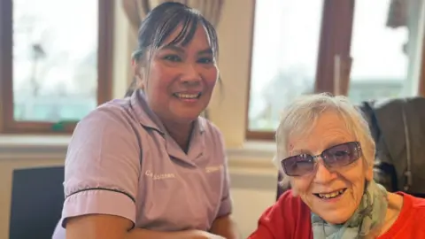 Care worker Cristita with Erskine resident Muriel