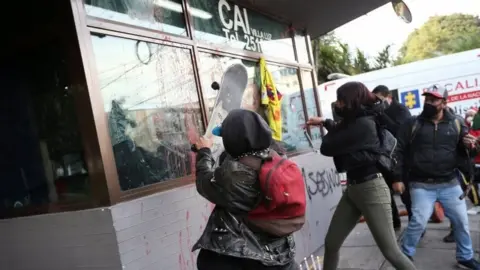 EPA People protest outside a police station after a man, who was detained for violating social distancing rules, died from being repeatedly shocked with a stun gun by officers, according to authorities, in Bogota, Colombia September 9, 2020.