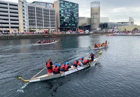 Salford City Council boat crews compete by theatre