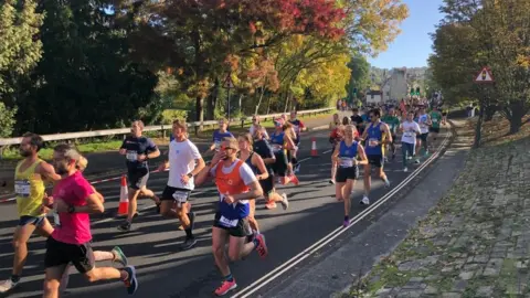 People running near trees
