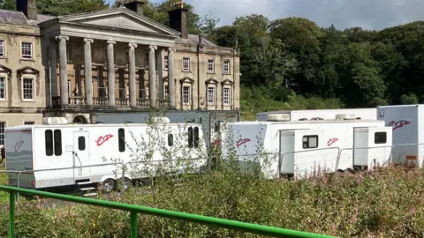 Location trailers stood outside the Glynllifon estate