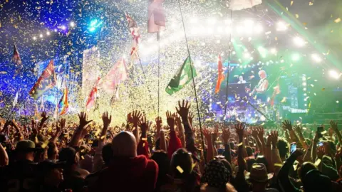 PA Media Elton John performing at Glastonbury festival in 2023