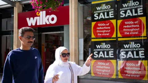 People walk past Wilko branch