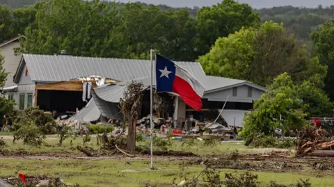 The exterior view of a Kerr County home damaged by historic flooding on 4 July