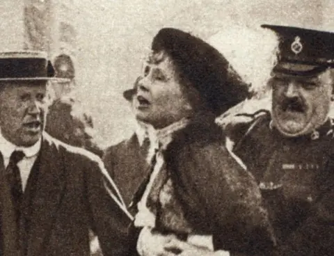 Getty Images Emmeline Pankhurst being arrested outside Buckingham Palace