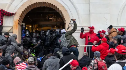Getty Images Officers fight in the West Terrace tunnel