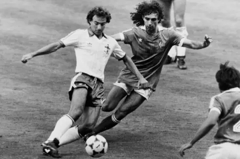 Getty Images Martin O'Neill controls the ball under pressure from a French opponent