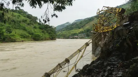 Pablo Cuellar Twisted metal lies by the bank of the river Cauca