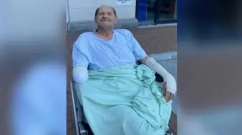 Sussex Police Vic Franklin, 79, from Bognor, sitting in a wheelchair having had two limbs amputated following an attack by two Rottweilers