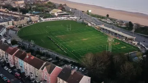 An aerial view of St Helen's with beach and sea in the background