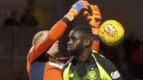Odsonne Edouard and Craig Samson contest possession