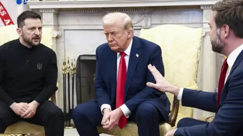 EPA Ukrainian President Volodymyr Zelensky (L) talks with US President Donald Trump (C) and US Vice President JD Vance (R) in the Oval Office of the White House 