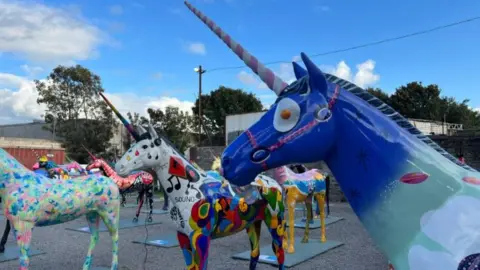 A group of unicorn sculptures