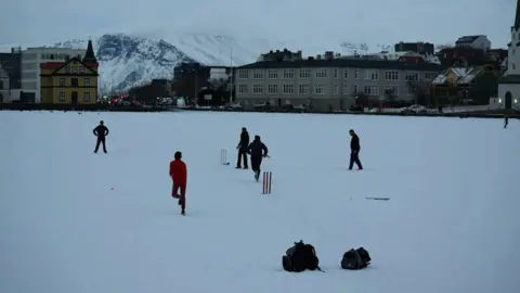 Iceland Cricket Icelandic cricketers playing on a snowy pitch