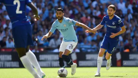 Reuters Manchester City's Riyad Mahrez in action with Chelsea's Jorginho in the Community Shield