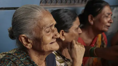 Vijay Bihani / Indus Images Survivors of the collapse were taken to hospital in Mumbai