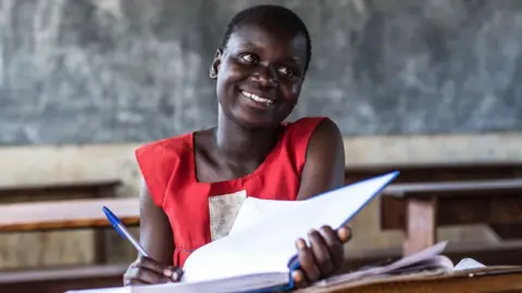 Unicef/Jimmy Adriko Faida, a Ugandan girl who has gone back to school thanks to support from DfID