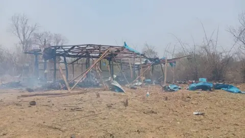 EPA Burnt remains of a civilian structure in Myanmar's Pa Zi Gyi village after an air strike in April 2023