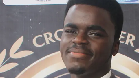 Government House media James Okina with an award