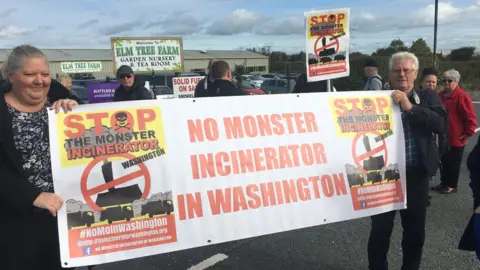 BBC Washington Incinerator Protesters With Banner