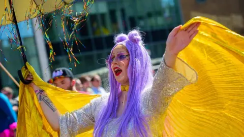 Mark Lewis A woman enjoying Pride