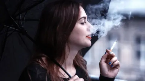 Getty Images Woman smoking