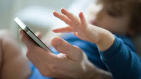 Alamy Child with phone