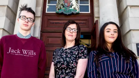 PA Siobhan McLaughlin (centre) with her children Billy and Rebecca Adams